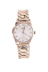 CA. 1956 9K GOLD ROAMER SWISS