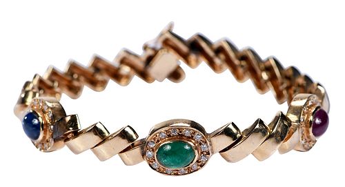 CABOCHON CUT RUBY, EMERALD, AND