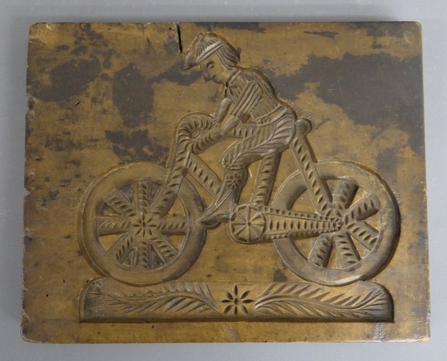 Cake mold. Man on safety bicycle.