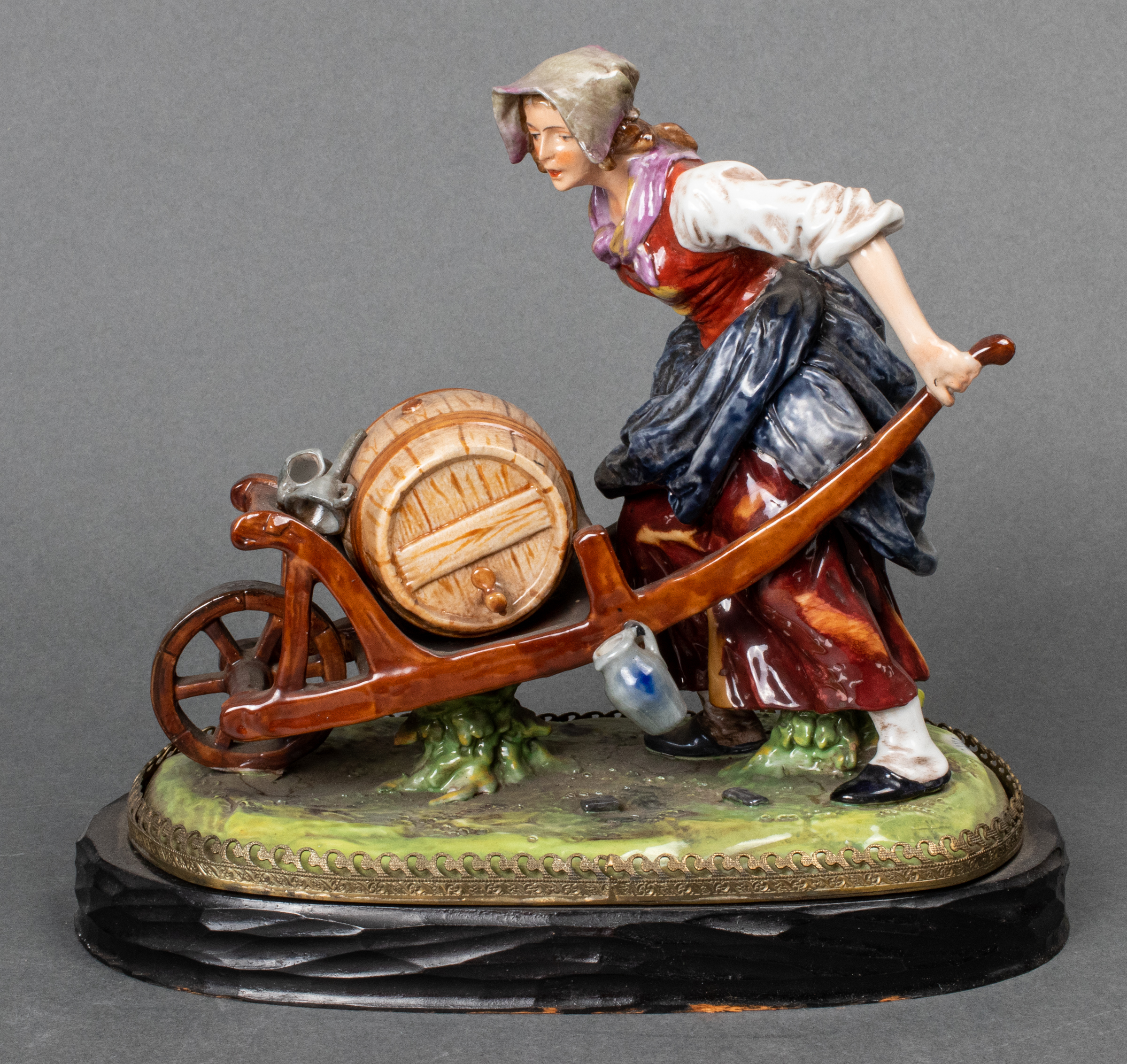 CAPODIMONTE PORCELAIN WOMAN PUSHING