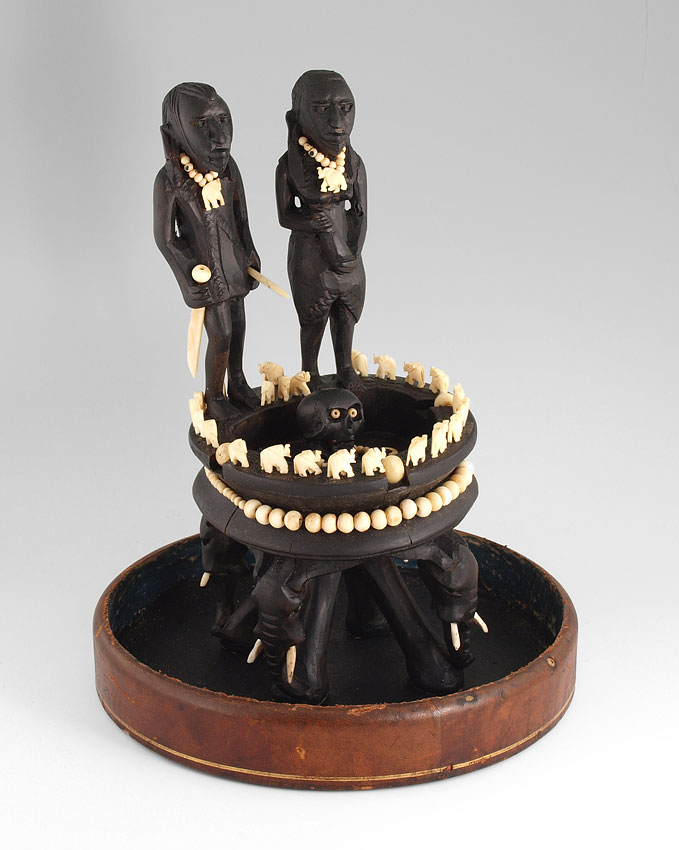 CARVED AFRICAN SCULPTURE UNDER