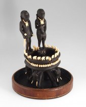 CARVED AFRICAN SCULPTURE UNDER