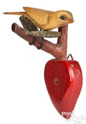 CARVED AND PAINTED BIRD ON HEA