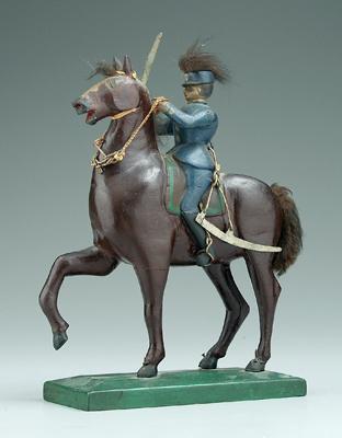 Carved and painted equestrian