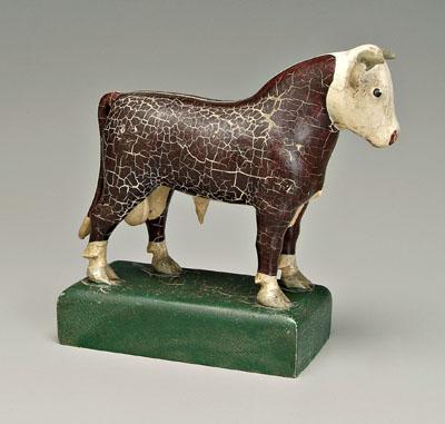 Carved and painted Hereford bull,