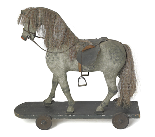 Carved and painted horse riding toy