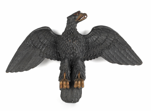 Carved and painted spread winged