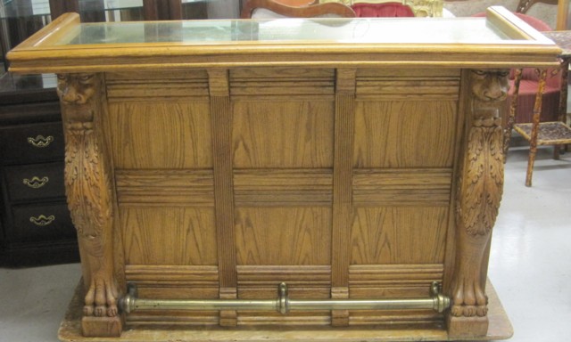 CARVED AND PANELED OAK FRONT BAR
