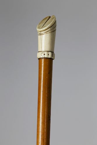 CARVED BONE AND MALACCA WOOD