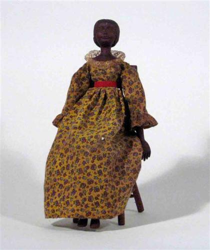 Carved doll with chair    20th