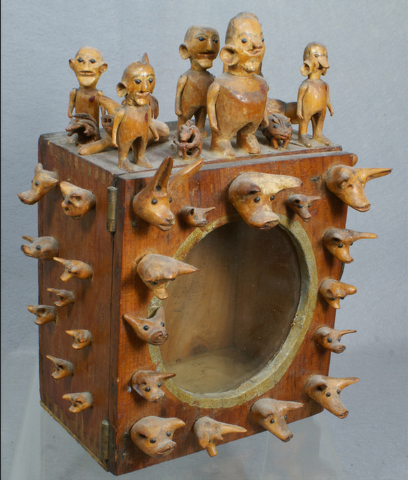 Carved figural folk art cabinet,