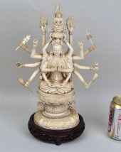CARVED FIGURE OF SEATED CUNDI