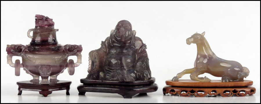 CARVED FLUORITE BUDDHA. Raised on a