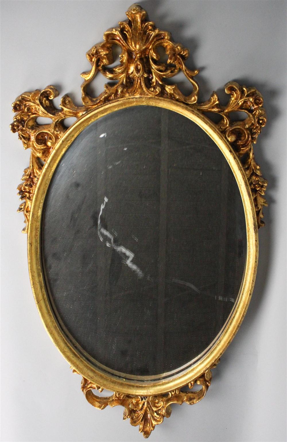 CARVED GOLD PAINTED OVAL MIRROR