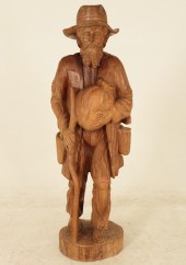 CARVED HARDWOOD FIGURE OF GOLD