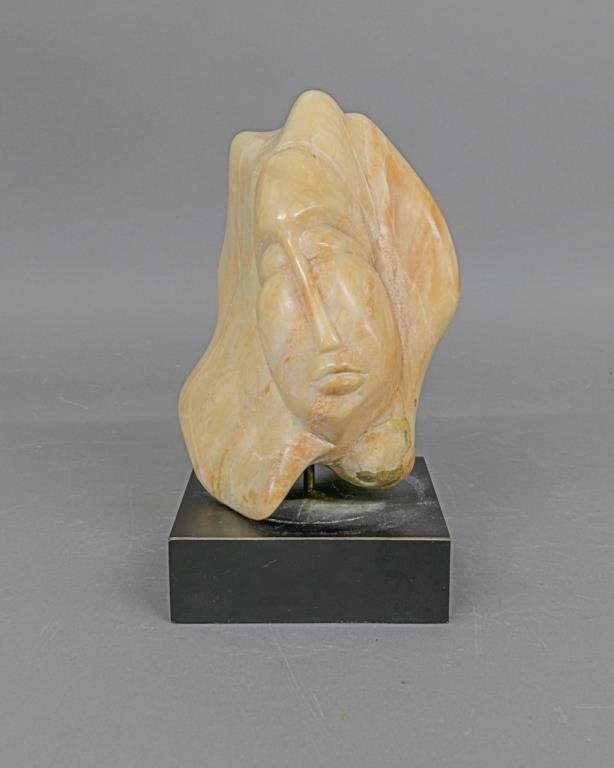 Carved head of a woman signed 'Gina