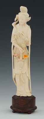 Carved Ivory Attendant Holding A