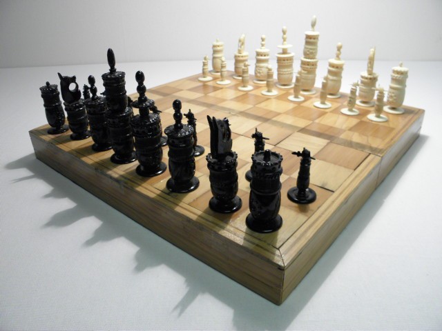 Carved ivory chess set. Half