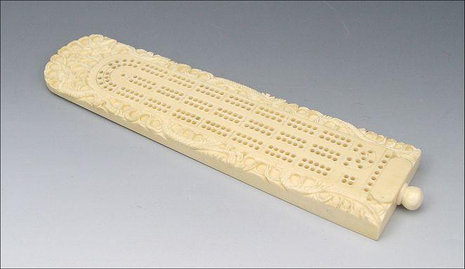 CARVED IVORY CRIBBAGE BOARD: Carved