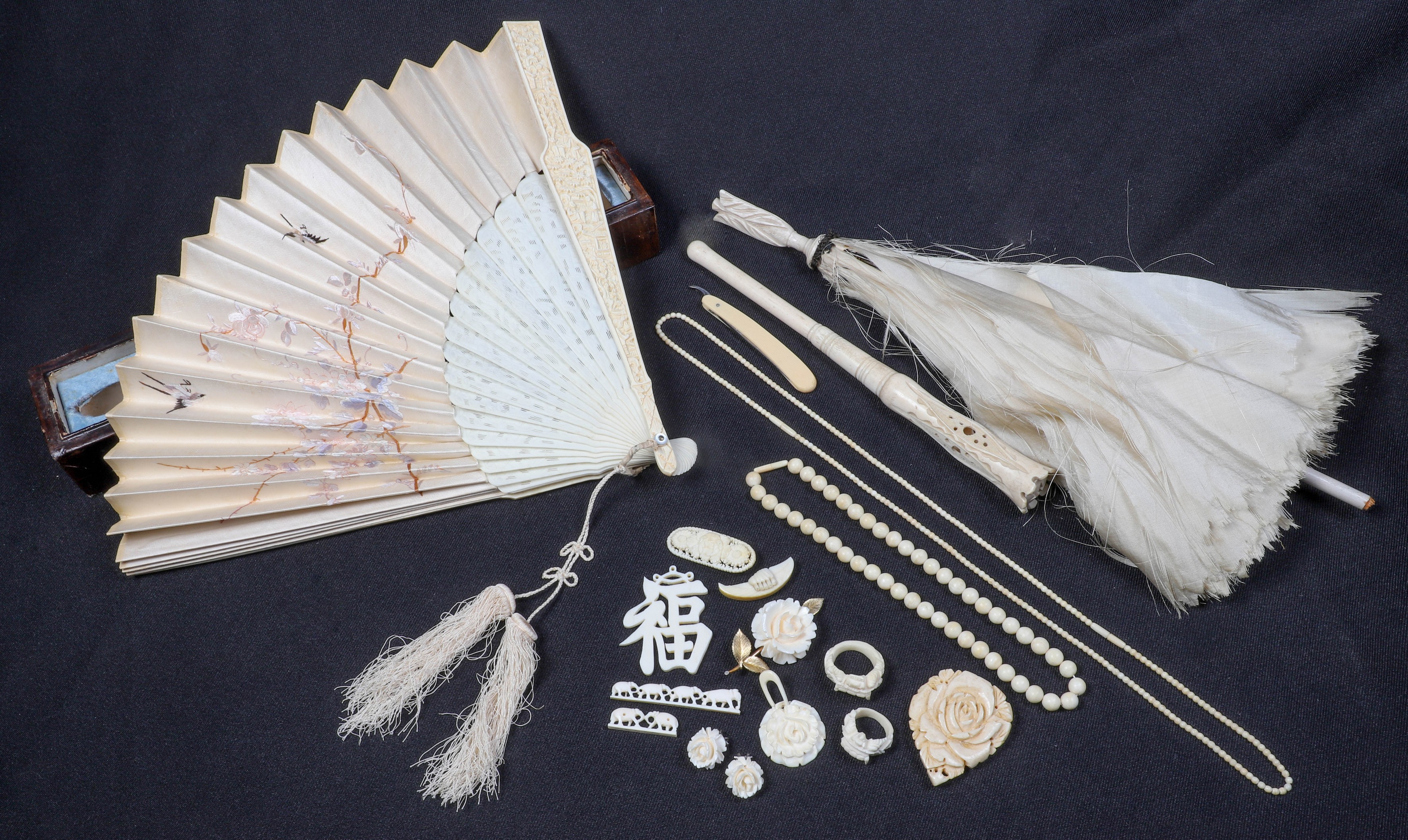 Carved ivory fan, jewelry and