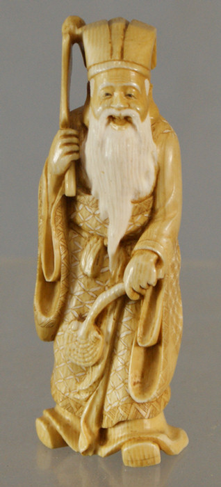 Carved ivory figure of an elder man