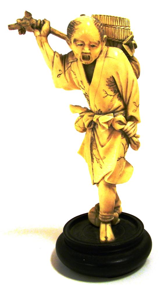 Carved ivory figure of Asian man