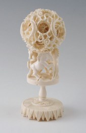 CARVED IVORY MYSTERY BALL ON H