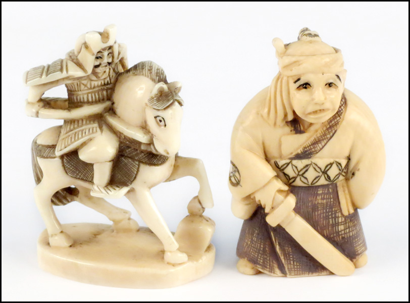 CARVED IVORY NETSUKE. Bearing a two