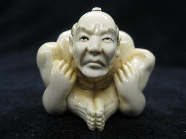 Carved Ivory Netsuke of a Seated