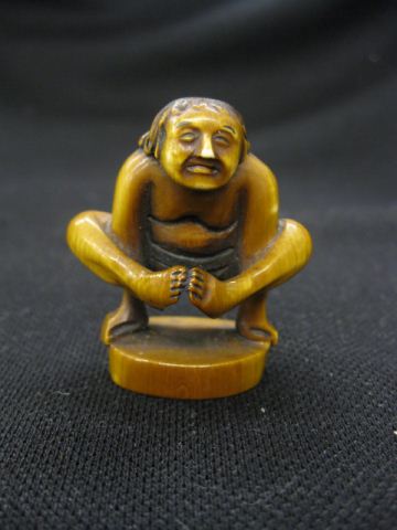 Carved Ivory Netsuke of a Man in