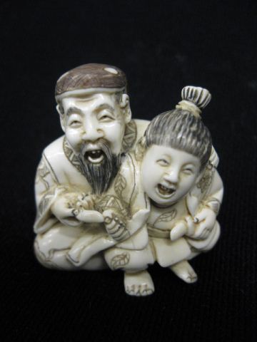 Carved Ivory Netsuke of Seated Man&