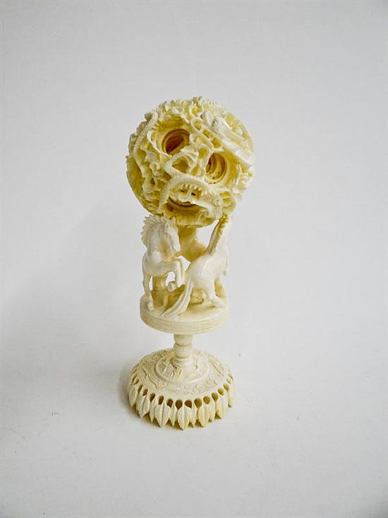 CARVED IVORY PUZZLE BALL ON STAND.