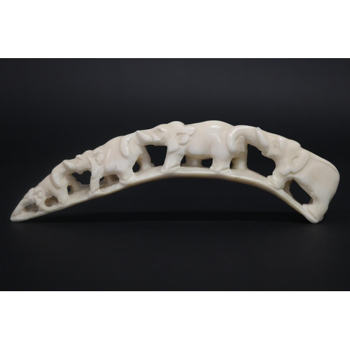 Carved ivory train of elephants,