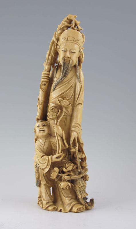 CARVED IVORY WISEMAN WITH CHILD: