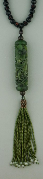 CARVED JADE CYLINDER ON TASSEL