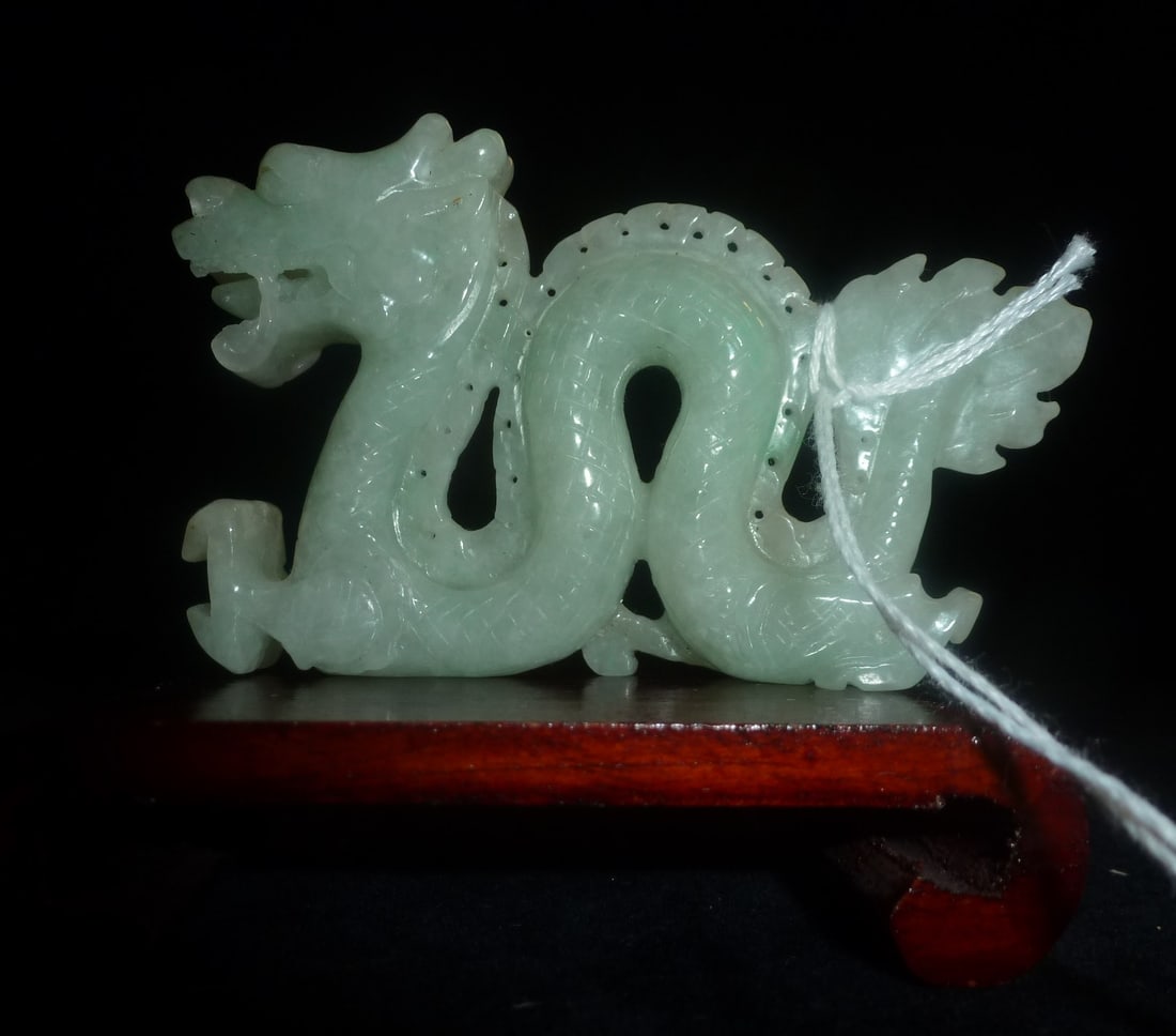 CARVED JADE DRAGON ON WOODEN