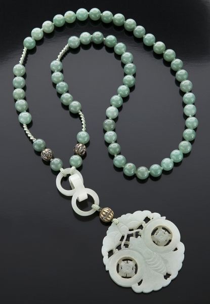 Carved jade pendant with aventurine