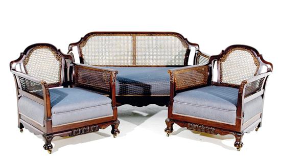 Carved mahogany and cane bergere