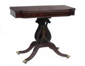 CARVED MAHOGANY GAMES TABLE AT
