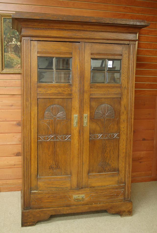 CARVED OAK AND BEVELED GLASS