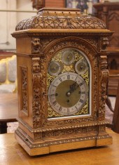 CARVED OAK CASED BRACKET CLOCK