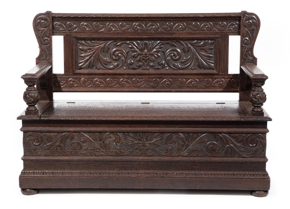 CARVED OAK HALL BENCH, MANNER OF