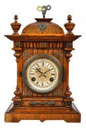 CARVED OAK MANTEL CLOCKwith re