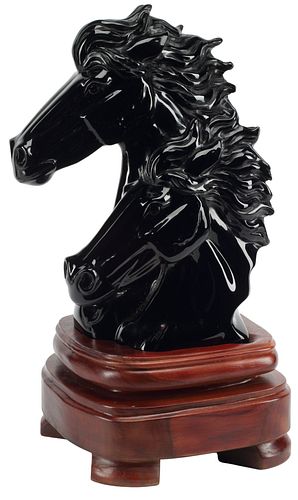 CARVED OBSIDIAN HORSE HEADS ON WOOD