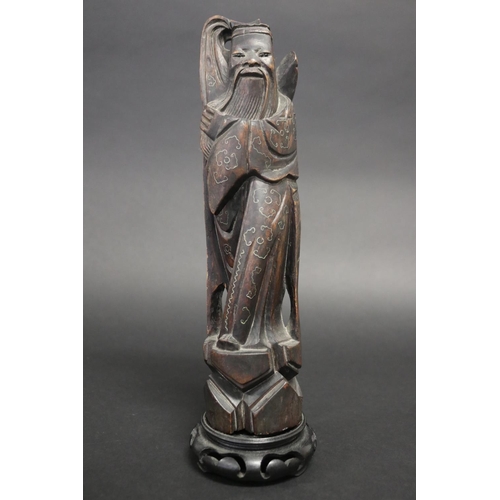 Carved Oriental god figure with