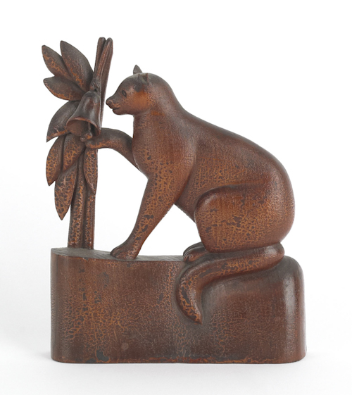 Carved pine figure of a cat ringing