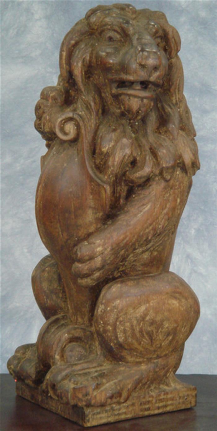 Carved pine figure of a lion