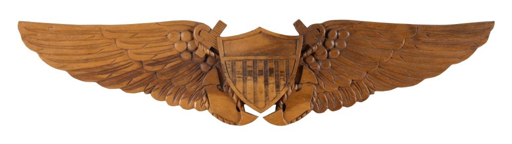 CARVED PINE PLAQUE IN THE FORM OF