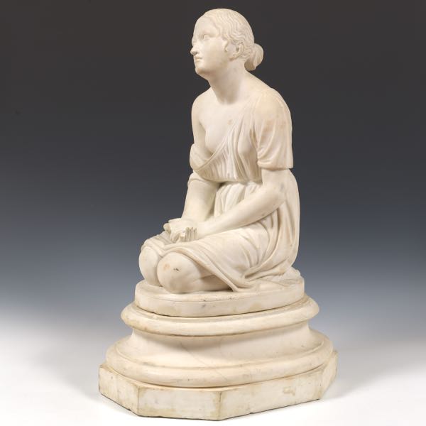 CARVED SCULPTURE OF A KNEELING