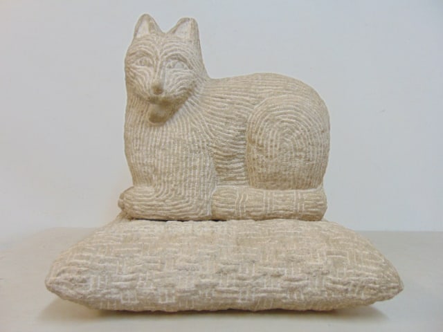 CARVED STONE CAT ON PILLOW,
